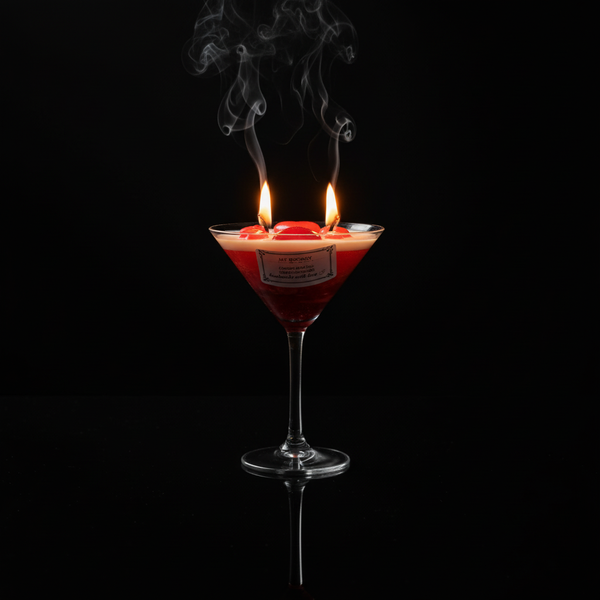 Premium candle with red hearts and two lit wicks on black reflective background