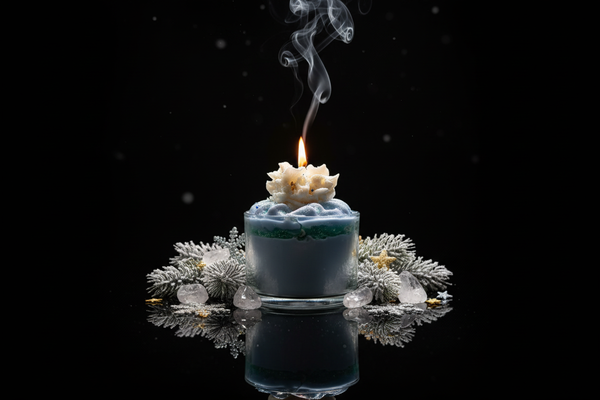 Winter-themed luxury candle with clear glass, flame, smoke, and festive elements on black reflective background